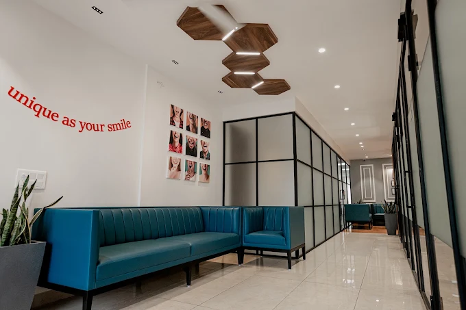 Modern patient lounge with 'unique as your smile' wall art